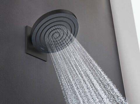 Faucets and showers with matte black surface finishes.