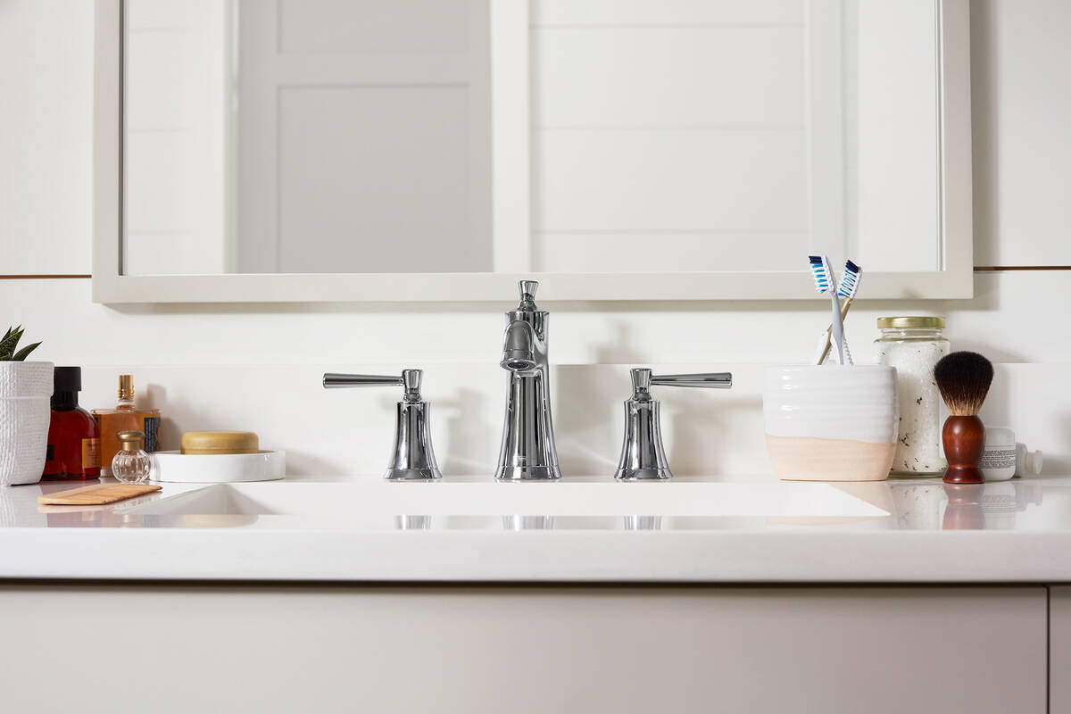 Bathroom with two handle chrome faucet