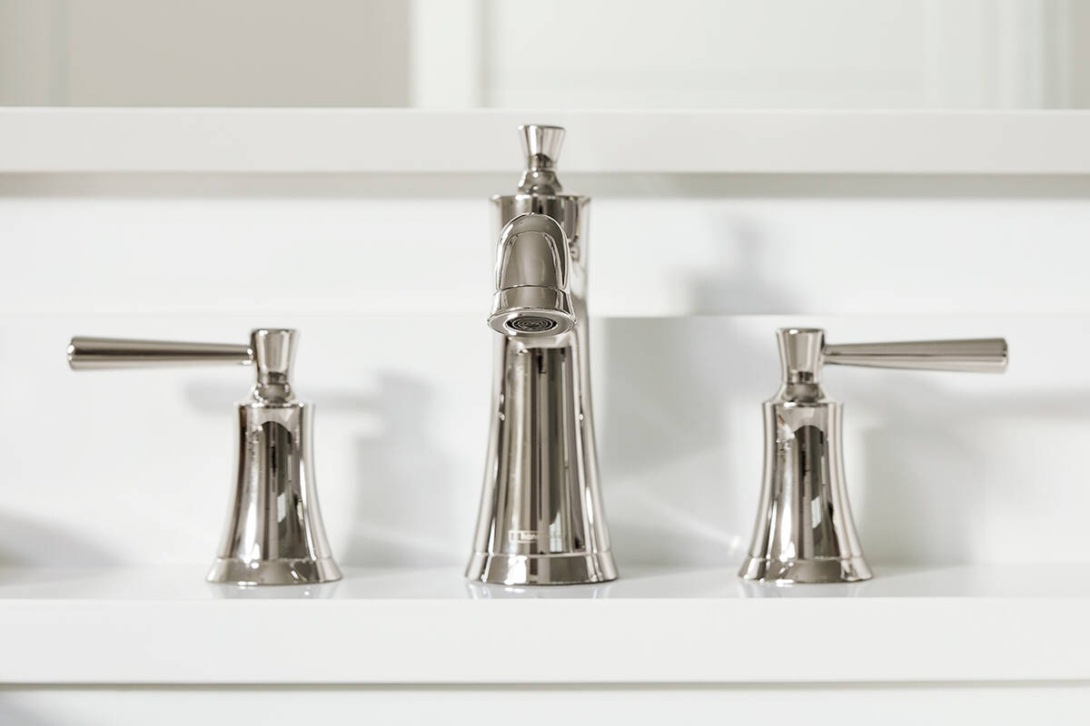 Tap in matt brushed bronze with a white wash basin.