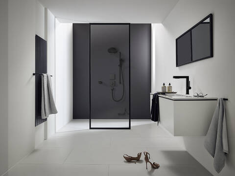 Faucets and showers with matte black surface finishes.