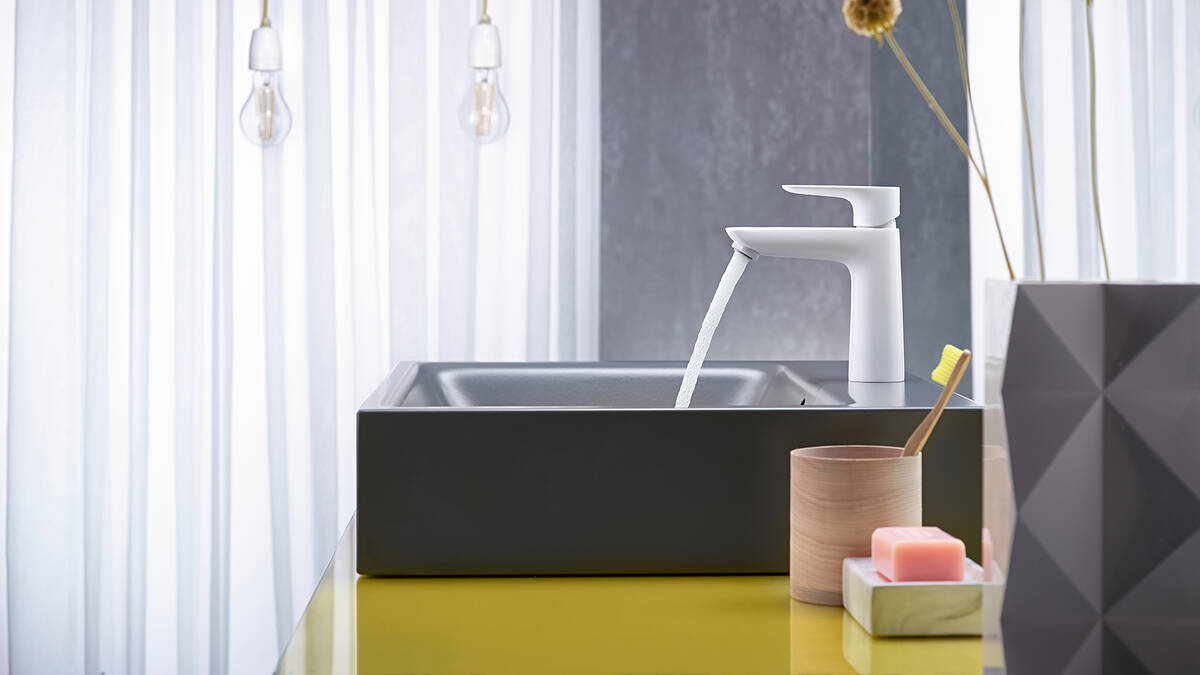 Elegant white bathroom tap with a white wash basin.
