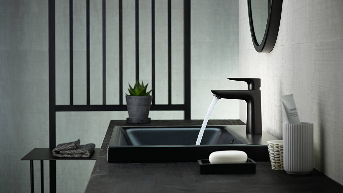 Black tap with a black wash bowl.