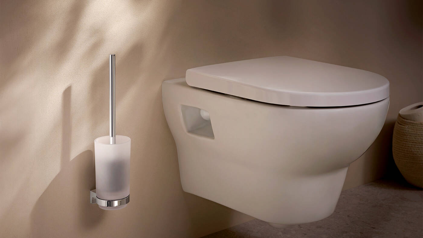 Toilet brush holder with glass and chrome.