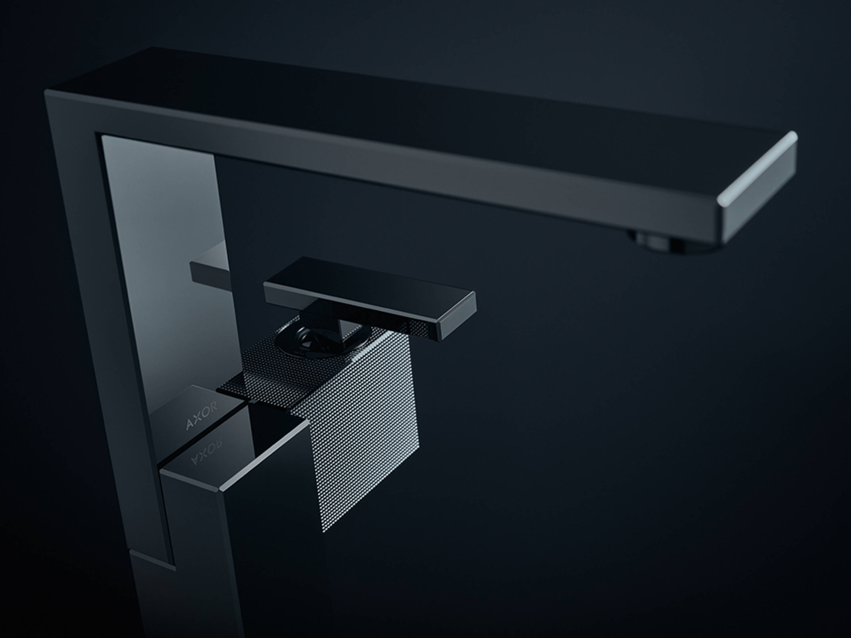 Faucet from the AXOR Edge bathroom collection in geometric design. Faucet from the AXOR Edge bathroom collection in geometric design.