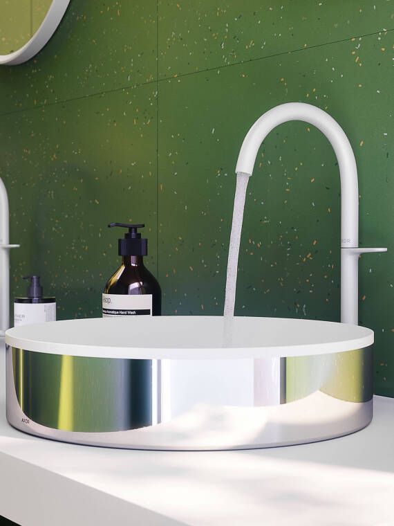Detail shot of the AXOR One faucet in Matt White and the AXOR Suite basin in white and chrome Detail shot of the AXOR One faucet in Matt White and the AXOR Suite basin in white and chrome