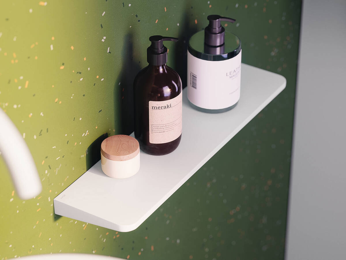 Detailed view of the AXOR Universal Circular shelf in matt white