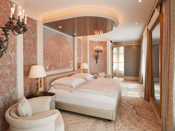 Master bedroom of the Ludwig Suite at Hotel Vier Jahreszeiten Kempinski Munich featuring bespoke interiors inspired by Bavarian heritage.