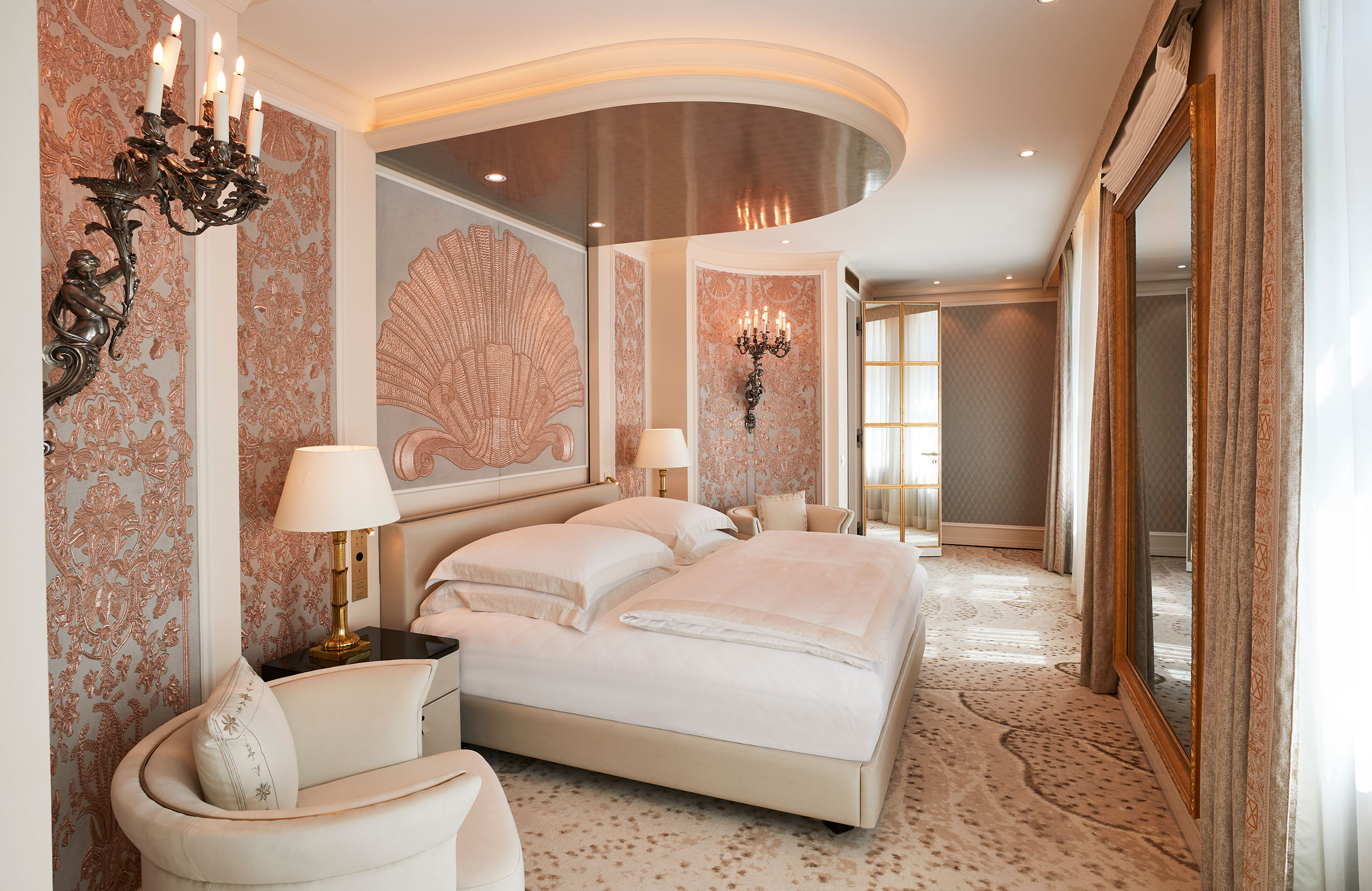 Master bedroom of the Ludwig Suite at Hotel Vier Jahreszeiten Kempinski Munich featuring bespoke interiors inspired by Bavarian heritage.