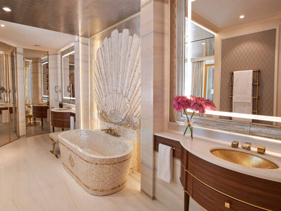 Bathroom of the Ludwig Suite at Hotel Vier Jahreszeiten Kempinski Munich featuring AXOR Urquiola faucets in Brushed Brass.