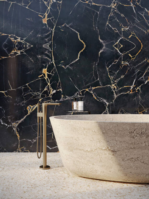 Close-up of the AXOR Citterio C freestanding bath mixer with shower holder.