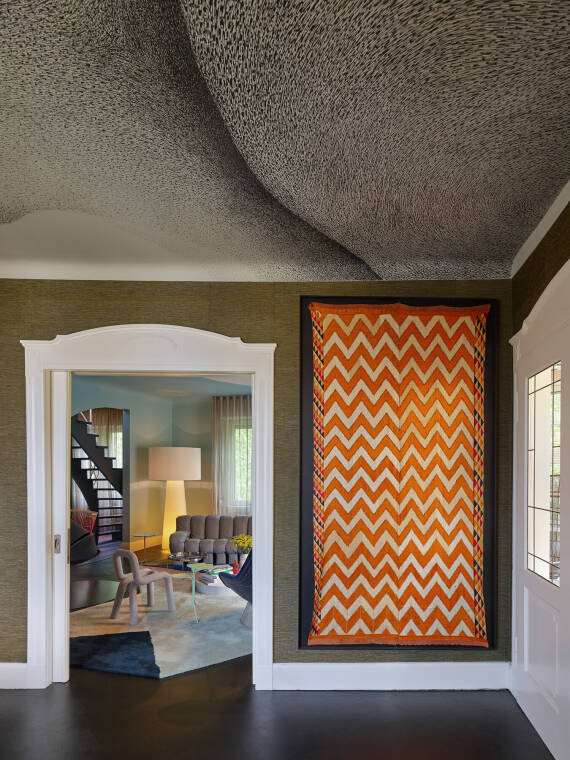 A wall tapestry with a zigzag pattern in Maisonette P155. A wall tapestry with a zigzag pattern in Maisonette P155.