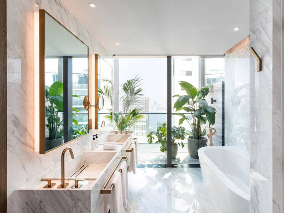 The Hari Suite bathroom with AXOR Citterio M faucets in Brushed Bronze. The Hari Suite bathroom with AXOR Citterio M faucets in Brushed Bronze.