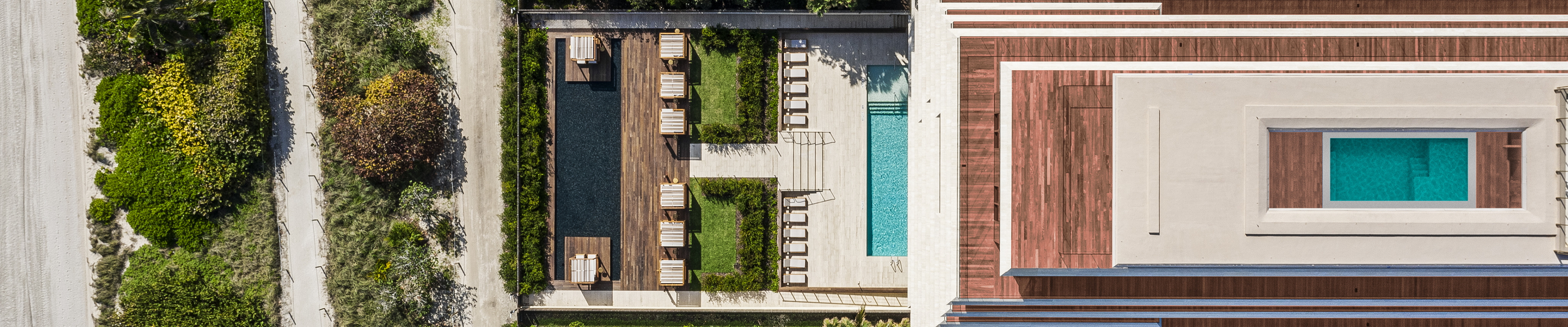 Aerial view of Arte Surfside Miami showing garden and pools.
