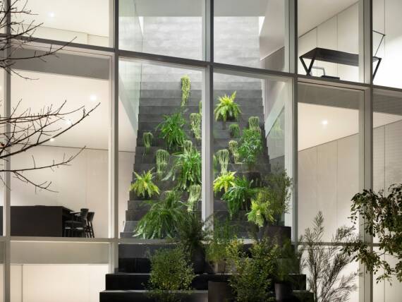 The home’s stairway-like structure doubles as a greenhouse. The home’s stairway-like structure doubles as a greenhouse.