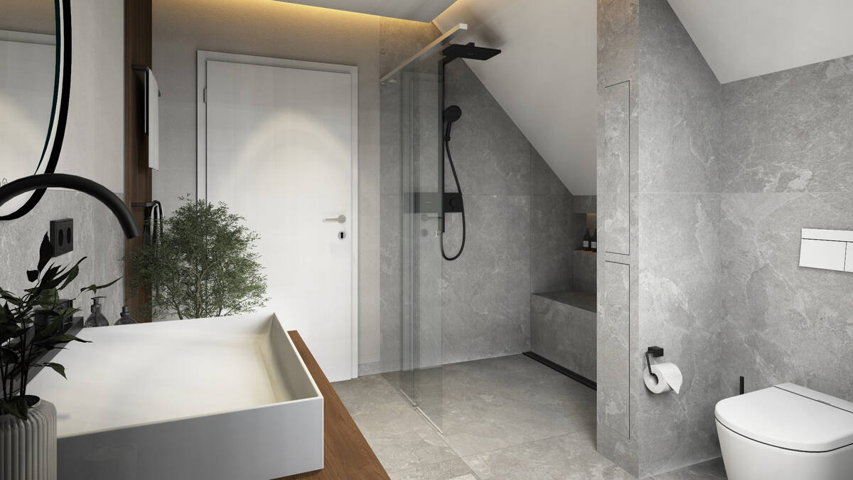 Badezimmer mit bodengleicher Dusche unter der Dachschräge.