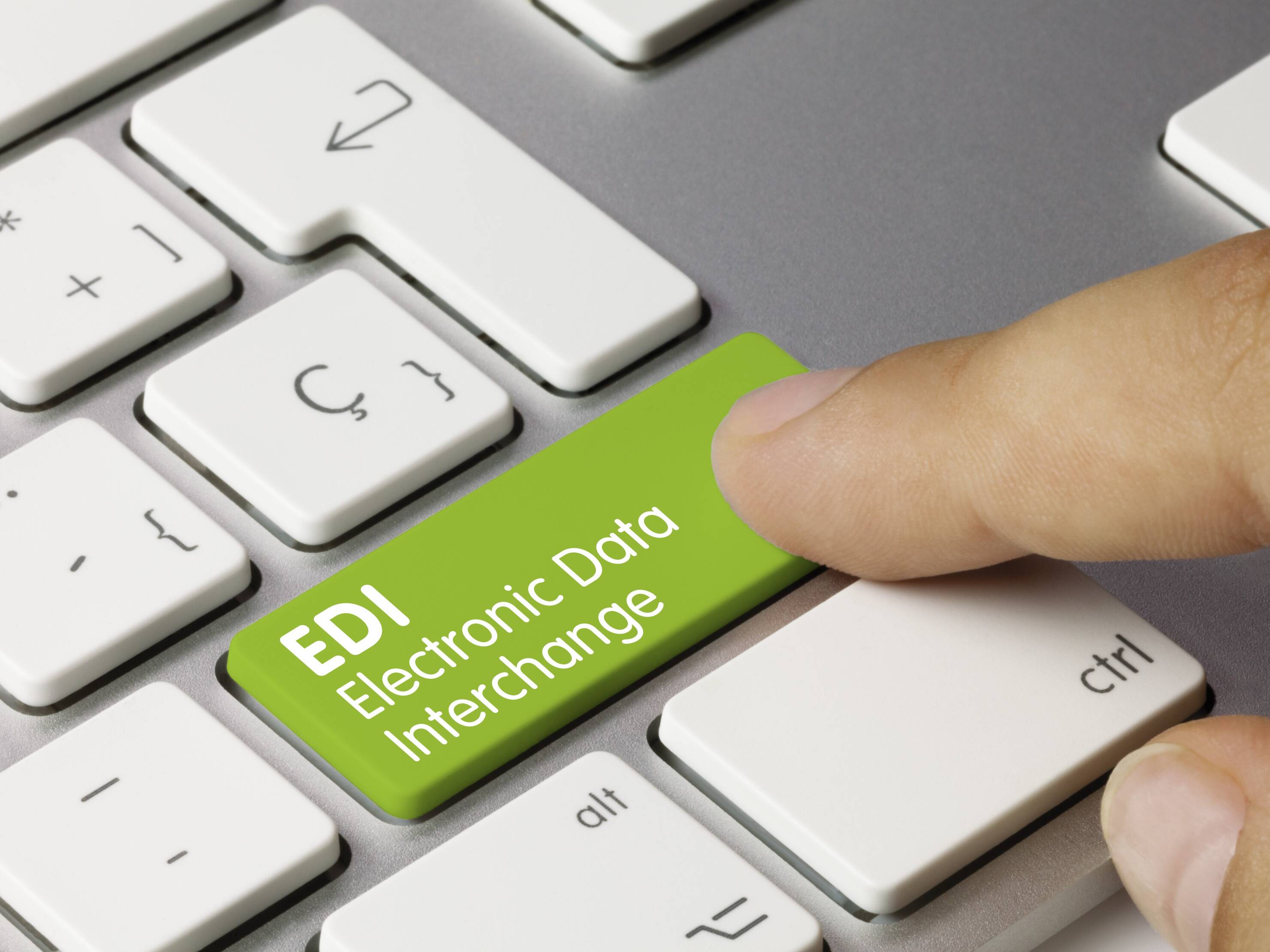 A man symbolically presses the EDI button