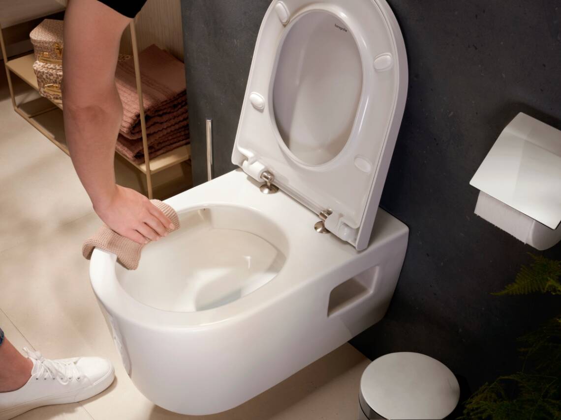 Rimless hansgrohe toilet being cleaned.