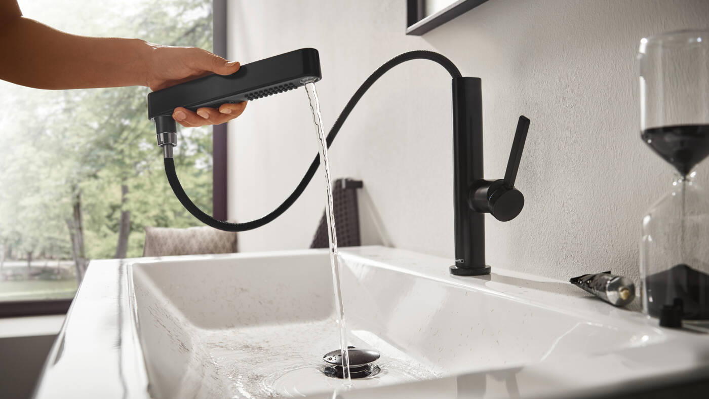 Matte black hansgrohe faucet with pull-out spray.