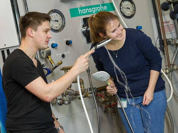 Two Hansgrohe hand showers undergo a sound-check.