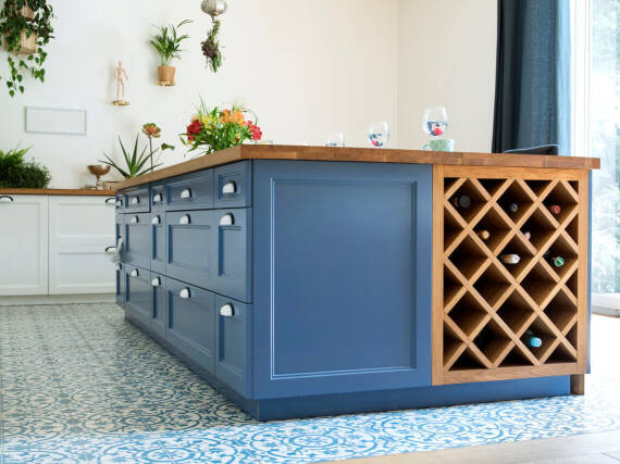 Blue kitchen island and blue and white Oriental-style flooring tiles in the kitchen.
