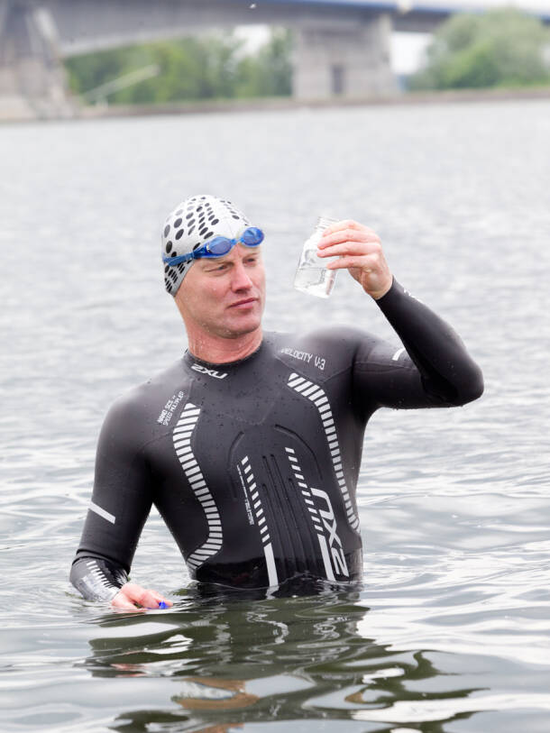 Andreas Fath takes samples of the Danube water.