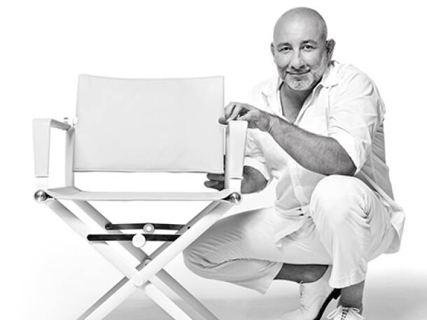 Designer Jean-Marie Massaud with folding chair. Designer Jean-Marie Massaud with folding chair.