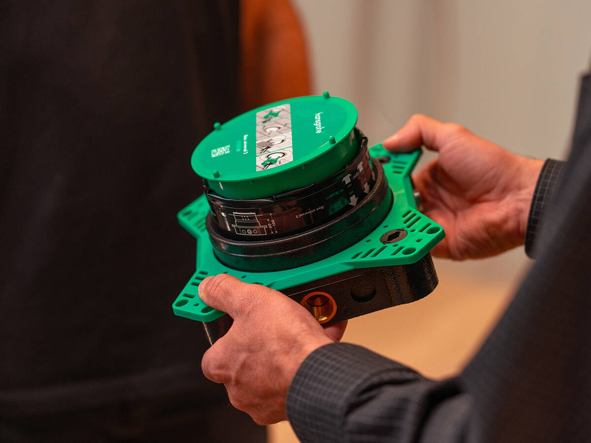 Man holding iBox universal in his hands.