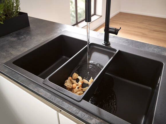 Sink with multi-function sieve and single lever tap.