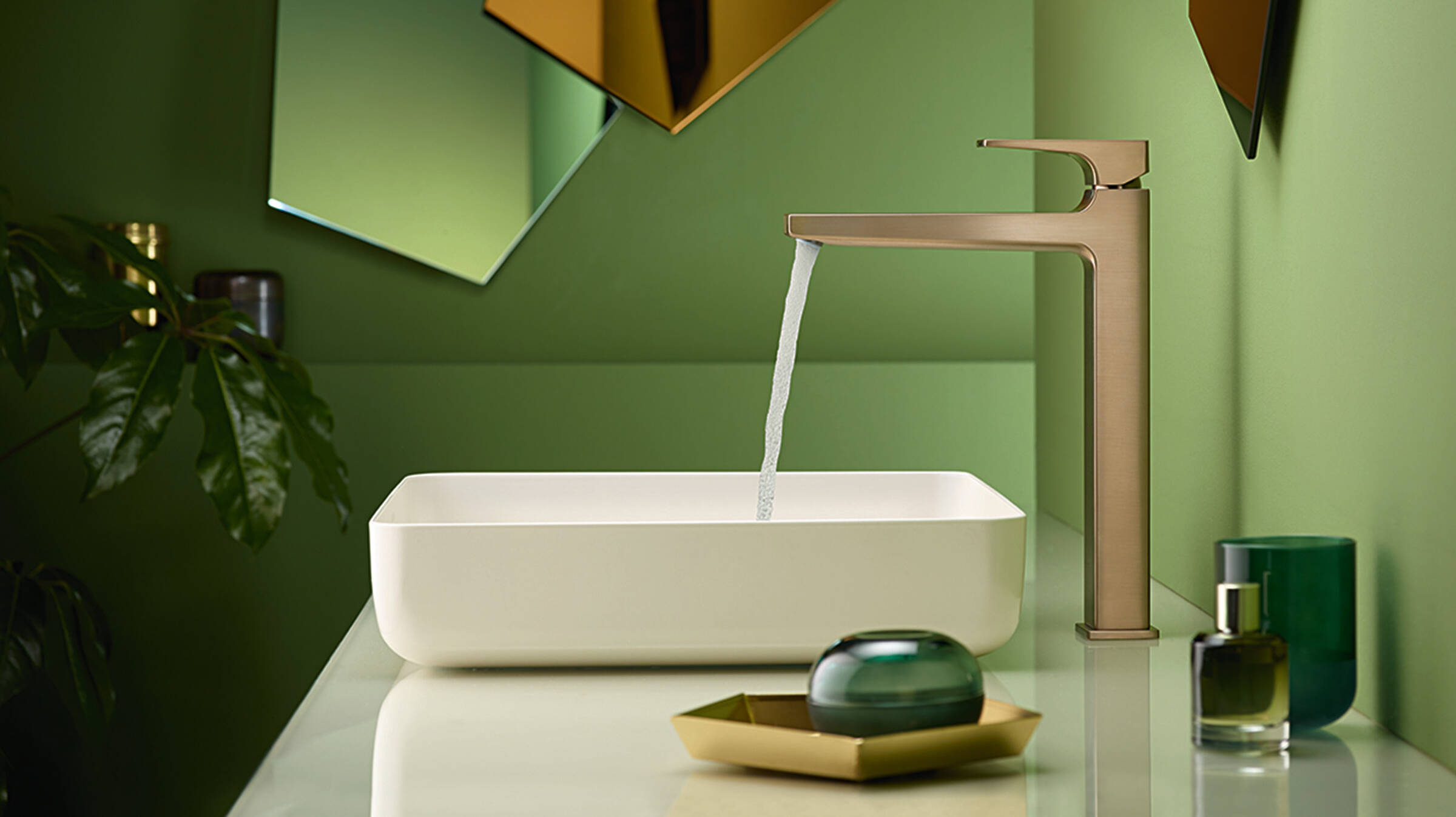 Tap in matt brushed bronze with a white wash basin.