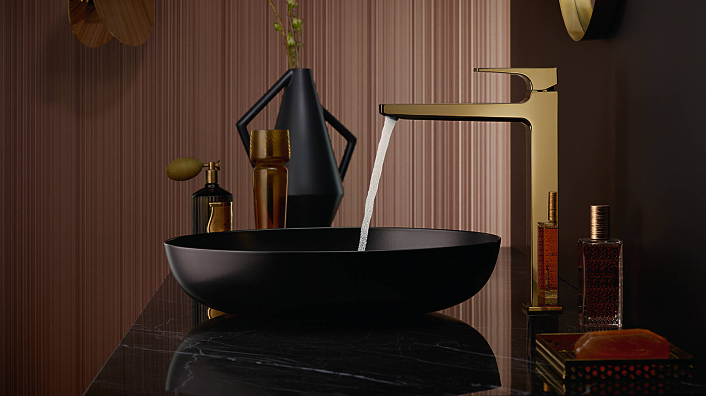 Gold basin tap matched with black.