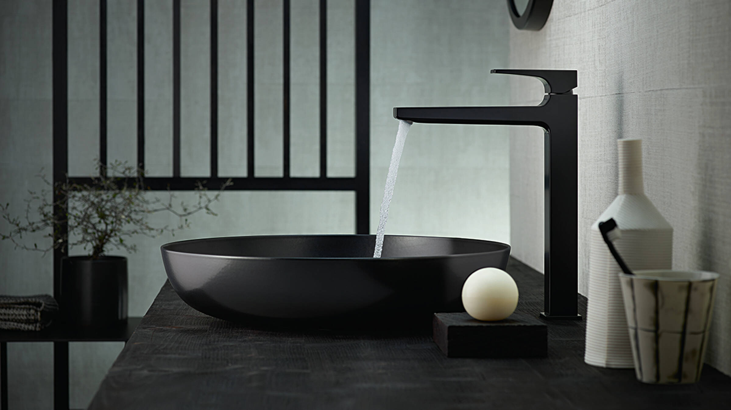 Black tap with a black wash bowl.
