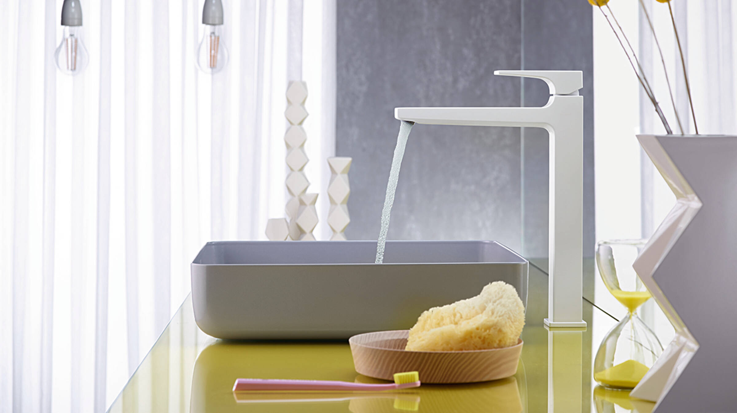 Elegant white bathroom tap with a white wash basin.