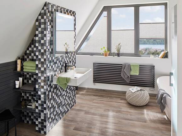 Pre-wall element with black and white mosaic tiling.