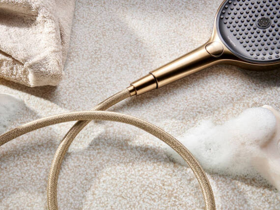 hansgrohe Designflex and hand shower in Polished Gold Optic.