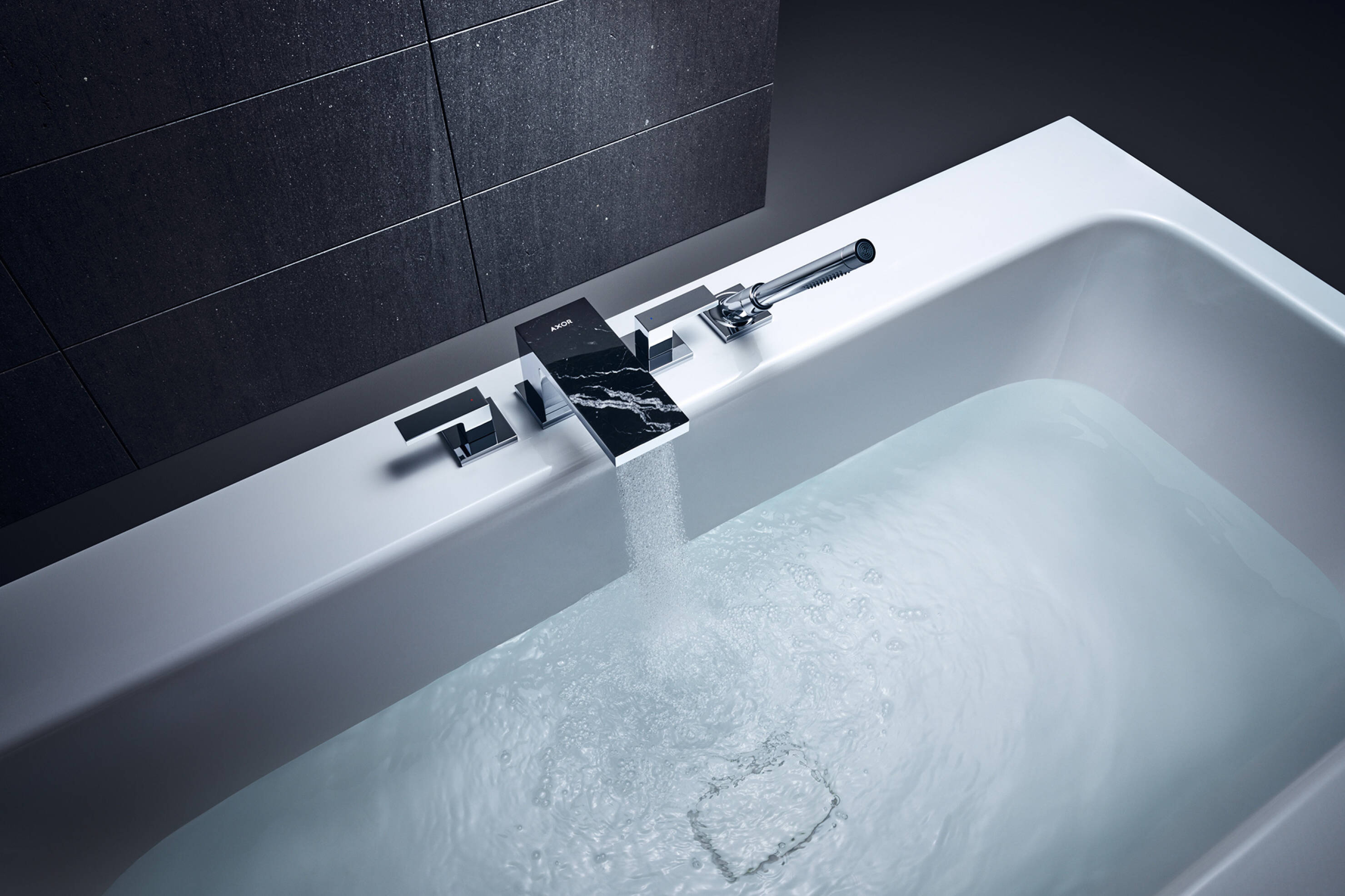 AXOR MyEdition bathtub mixer. Nero Marquina marble plate.