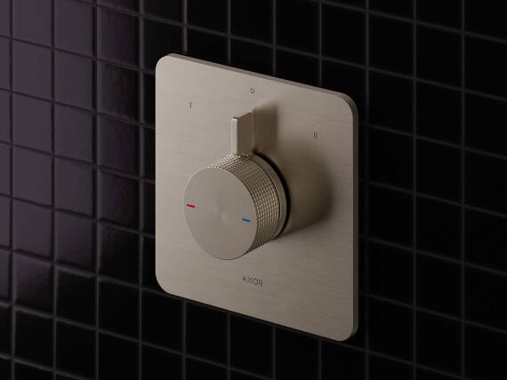 Close-up of the AXOR Citterio C shower faucet for concealed installation on a dark background