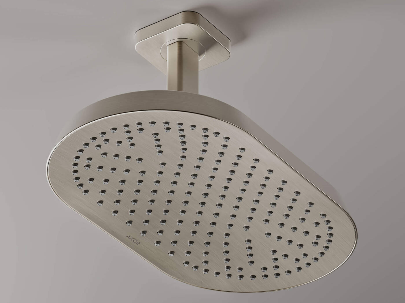 Close-up of an AXOR ShowerSphere overhead shower with ceiling connector in chrome.