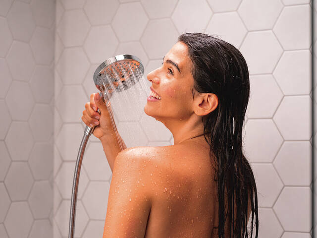 Switch sprays at the touch of a button on the Raindance shower head.