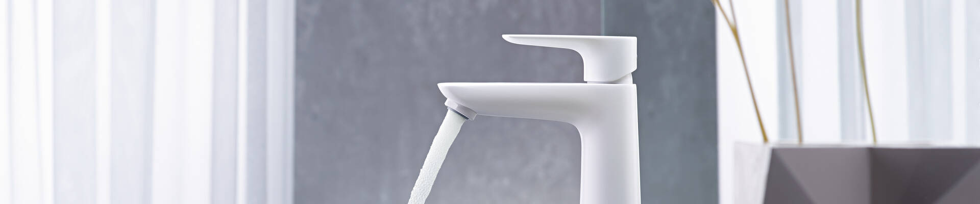 Talis bathroom taps with the intuitive Select push button. Talis bathroom taps with the intuitive Select push button.