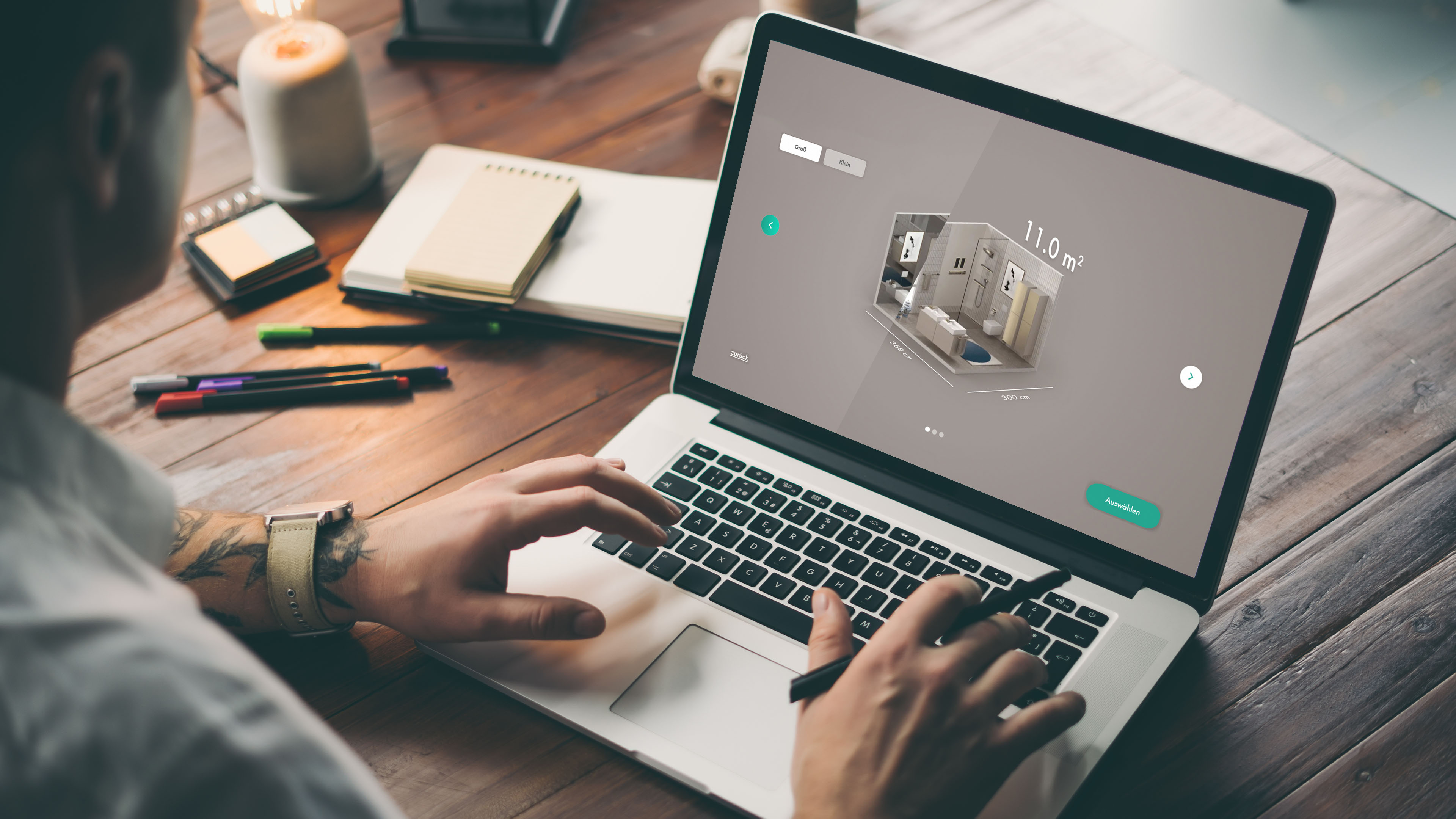 Man planning his dream bathroom using the hansgrohe Inspirator tool.