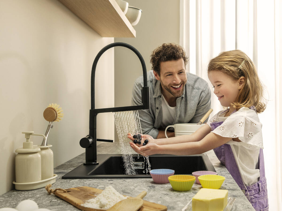 Child discovering Talis Select M54 PowderSpray.