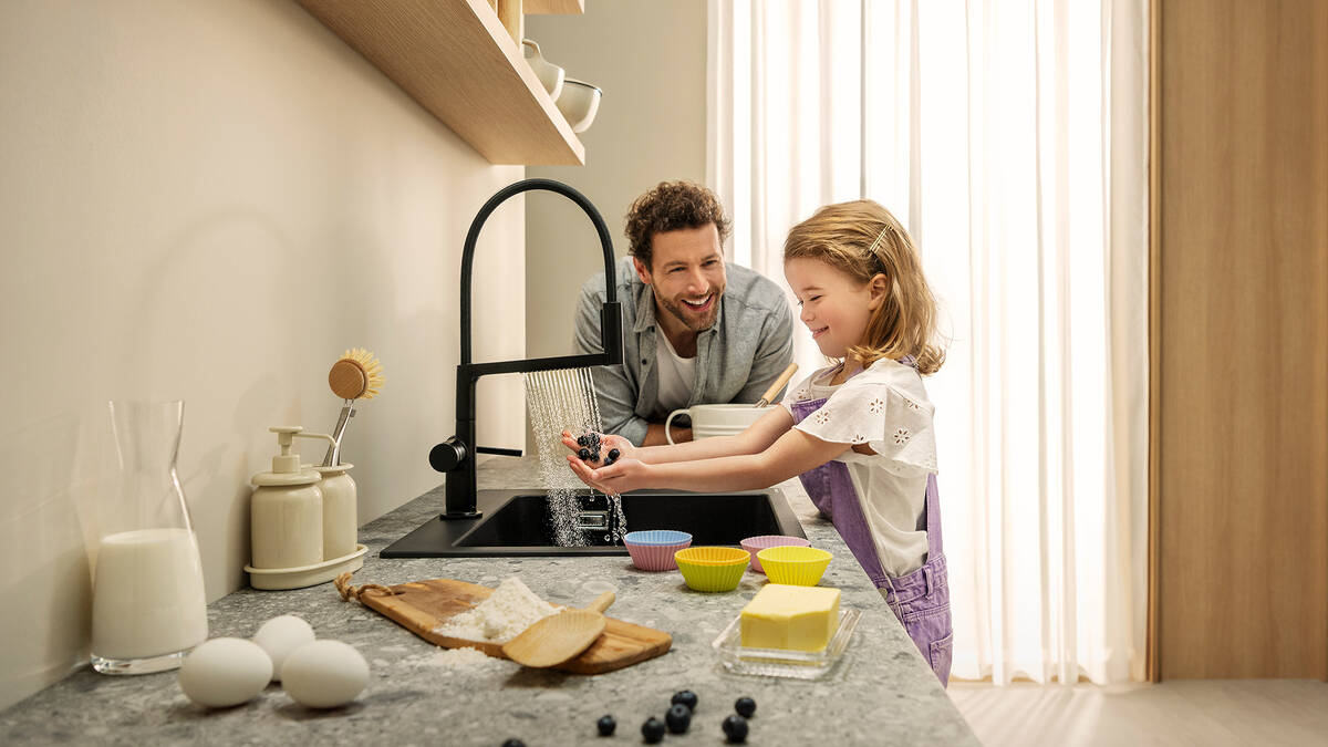 Child discovering Talis Select M54 PowderSpray.