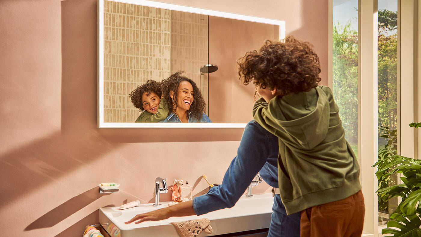 Woman and child at the vanity with Xarita mirror.