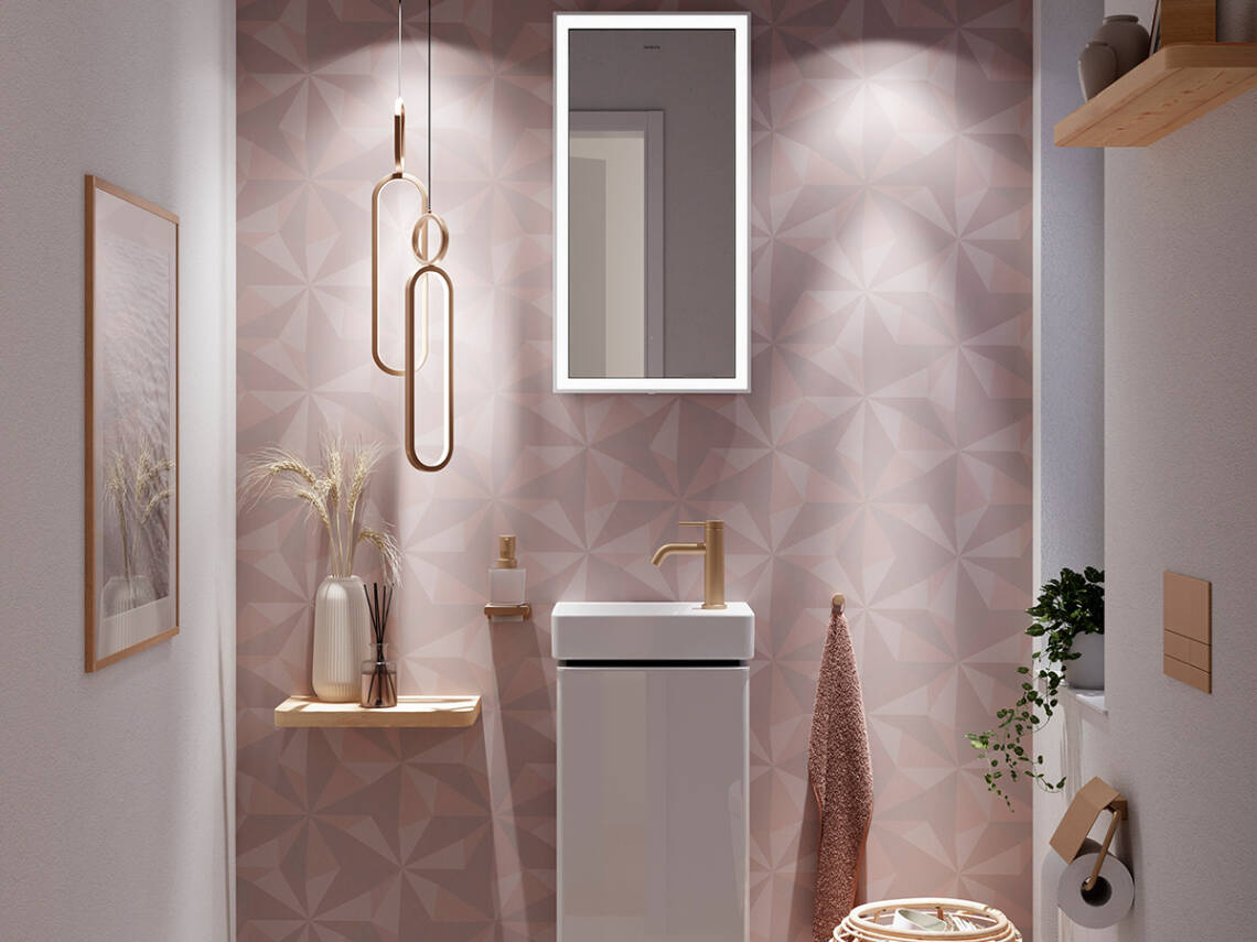 Xarita E Spiegel über Handwaschbecken im Gäste-Bad.