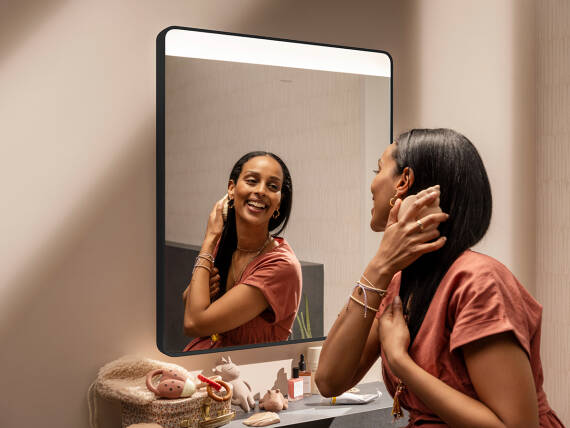  Woman checks her appearance in the Xarita Lite mirror.