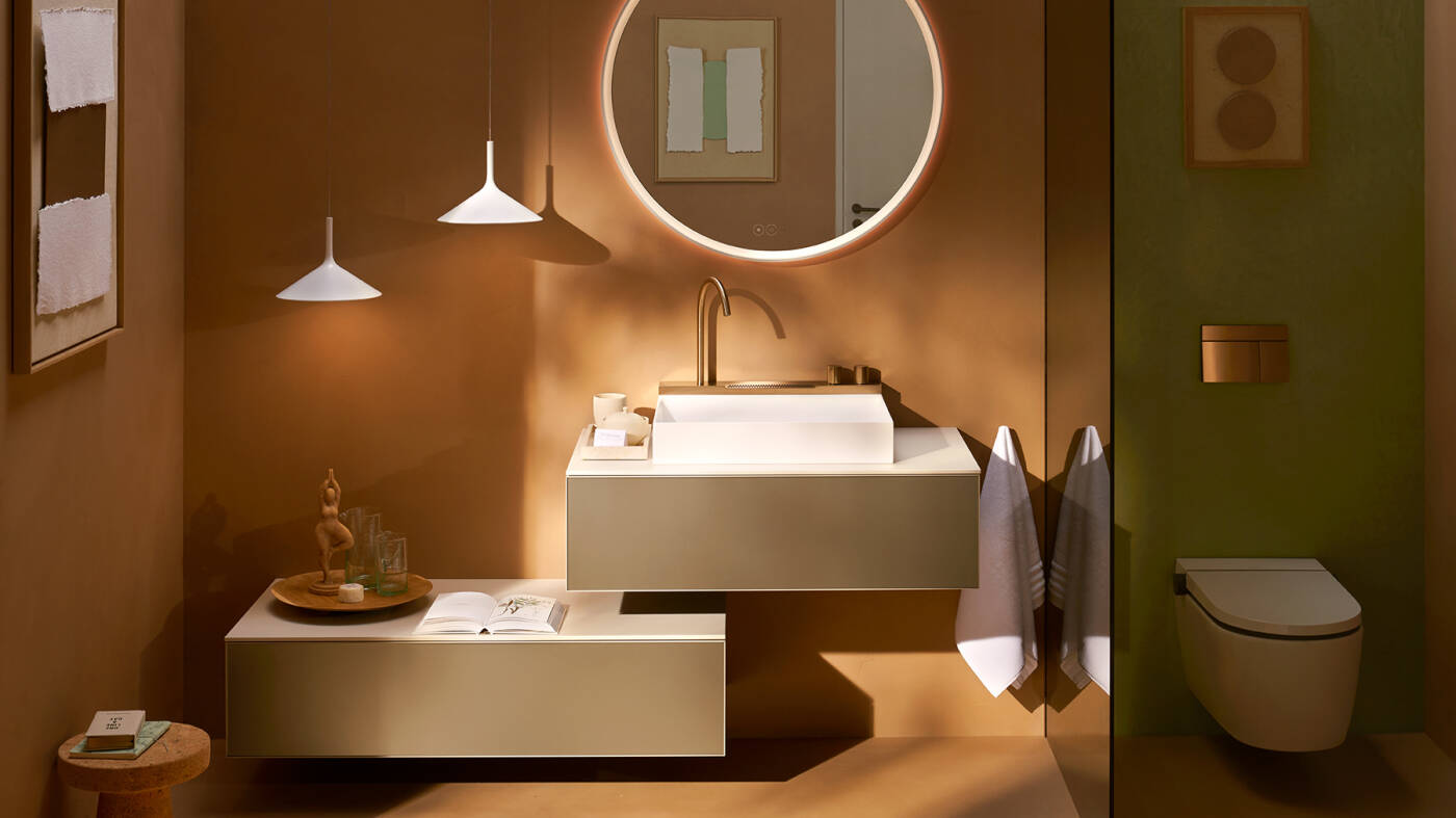 hansgrohe bathroom with seating, LED mirror and toilet.